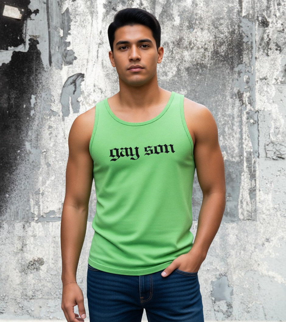 Man wearing a green tank top with 'gay son' text against a textured wall.
