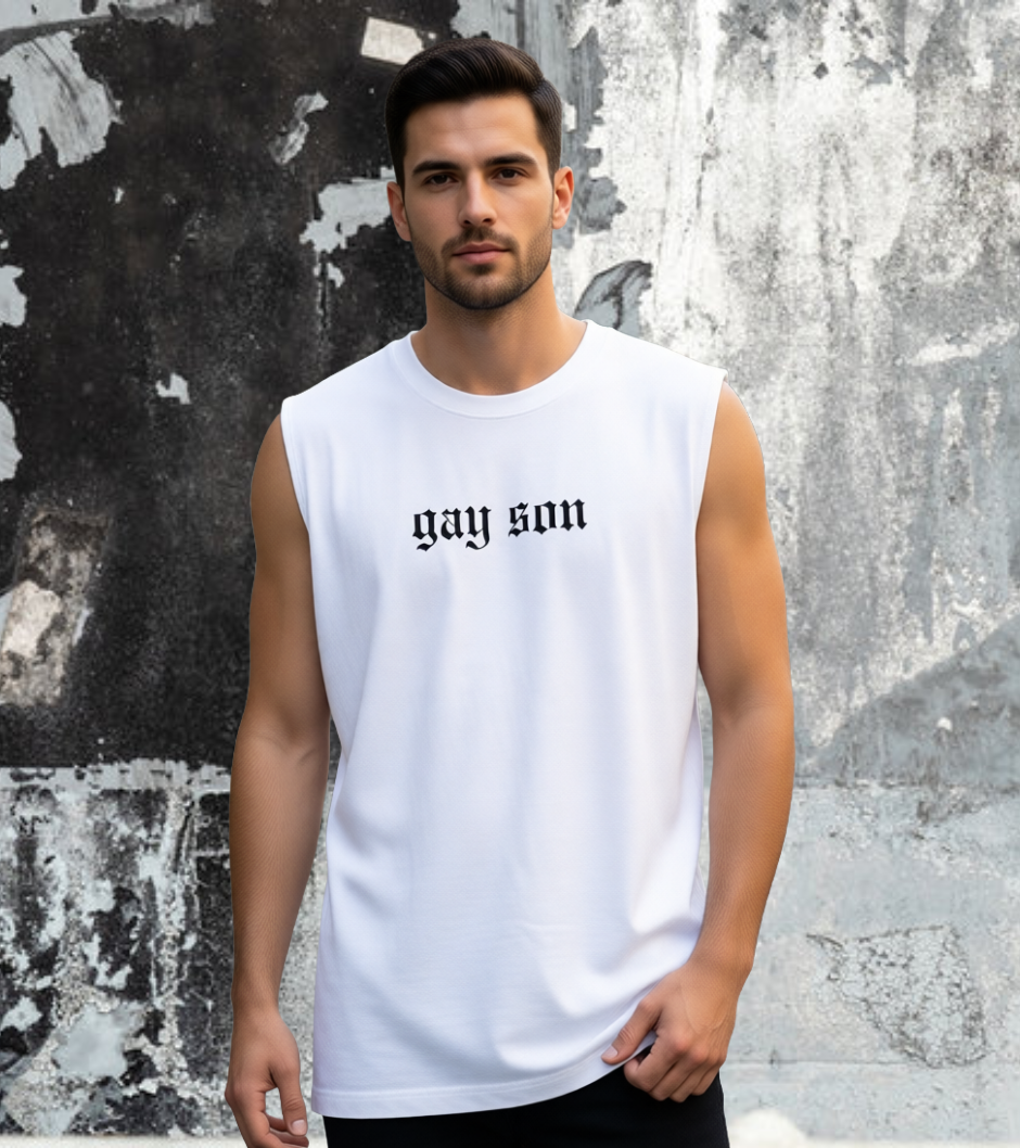 Man wearing a white sleeveless shirt with 'gay son' text against a textured wall.
